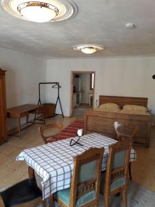 a room with a table and chairs and a bed at Blick aufs Goldene Dachl in Innsbruck
