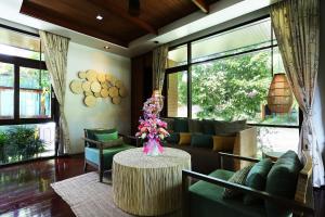 a living room with a couch and a table at AKIRA Lipe Resort in Ko Lipe