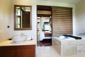 a bathroom with a large sink and a tub at AKIRA Lipe Resort in Ko Lipe