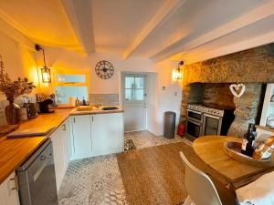 a kitchen with a table and a counter top at 3 Peters Terrace in Truro