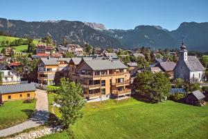 an aerial view of a town with a church at die Tauplitz Lodges - Alm Lodge A6 by AA Holiday Homes in Tauplitz