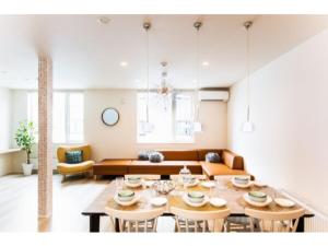 a living room with a table and a couch at Terrace Toyohira / Vacation STAY 81232 in Sapporo