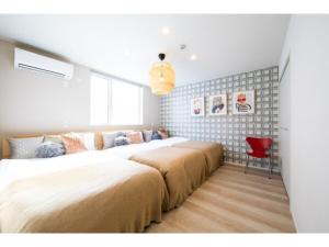 Ένα ή περισσότερα κρεβάτια σε δωμάτιο στο Terrace Toyohira / Vacation STAY 81232