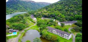 an aerial view of a house next to a river at Eden Wilds 38 in Port Edward