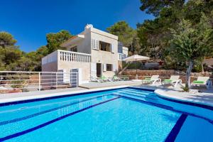 a villa with a swimming pool and a house at Villa in Ibiza Town, sleeps 6 - Can Damia in Sant Jordi