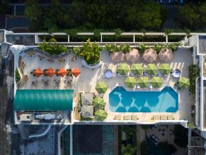 an overhead view of a resort with a swimming pool at Mayfair House Hotel & Garden in Miami