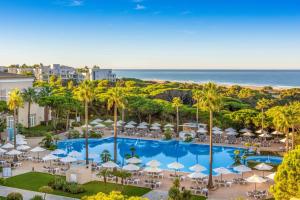 an aerial view of the resort with a swimming pool and the beach at Valentin Sancti Petri in Chiclana de la Frontera