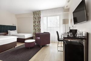 Posteľ alebo postele v izbe v ubytovaní Hotel Moderno Poznań