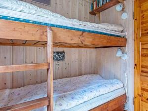 a bedroom with two bunk beds in a cabin at 6 person holiday home in Sandefjord-By Traum in Sandefjord