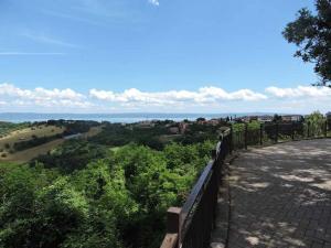 a view of the ocean from the top of a hill at La Mela Rosa in Valentano