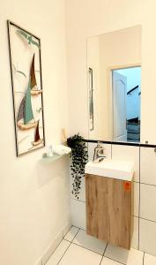 a bathroom with a sink and a mirror at A+ Budapest Downtown Apartments in Budapest