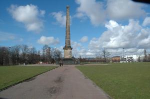 a tall obelisk in a park with a path in front at The Nelson - Spacious City Property and Free Parking in Glasgow