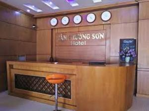 a lobby with a counter with a sign that reads my living son hotel at Tan Truong Son Hotel in Dong Hoi