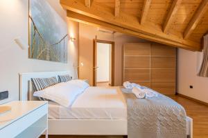 Posteľ alebo postele v izbe v ubytovaní Apartment Tamara Suite - Menaggio