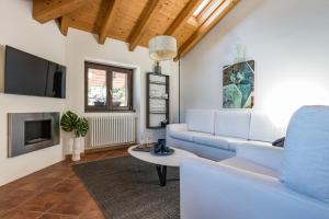 Televízia a/alebo spoločenská miestnosť v ubytovaní Apartment Tamara Suite - Menaggio
