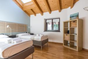 Posteľ alebo postele v izbe v ubytovaní Apartment Tamara Suite - Menaggio