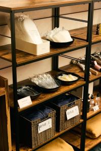 a shelf with baskets and plates on it at HOTEL THE ROCK in Osaka