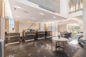 a lobby of a hotel with a reception desk at City Premiere Hotel Apartments - Dubai in Dubai