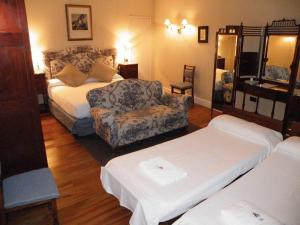 Postel nebo postele na pokoji v ubytování Posada Real Casa de Tepa