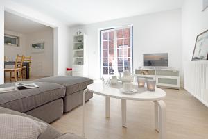 a living room with a couch and a table at Cap Blanco in List
