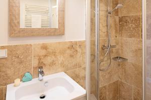a bathroom with a sink and a shower at Sylter Perle in List