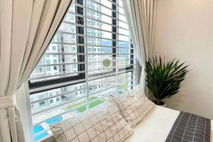 Ένα ή περισσότερα κρεβάτια σε δωμάτιο στο A' Casa Homestay Ipoh Perak