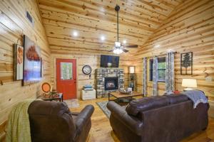 a living room with a couch and a fireplace at Shear Pleasure in Broken Bow