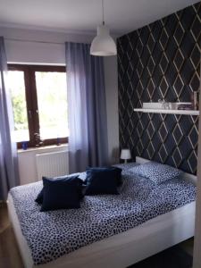 Posteľ alebo postele v izbe v ubytovaní Apartament Magda + 4 fotografie