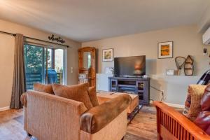 a living room with a couch and a television at MTN Town Escape-Beavers Den, 1 Bdrm luxury Apt in Green Mountain Falls