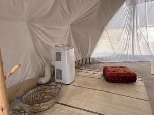a room with a heater in a tent at agafay valley in Marrakech