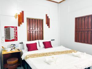 Postel nebo postele na pokoji v ubytování Lotus Blanc Homestay