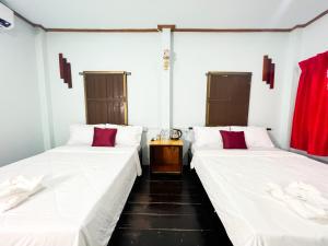 Postel nebo postele na pokoji v ubytování Lotus Blanc Homestay