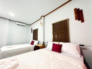 Postel nebo postele na pokoji v ubytování Lotus Blanc Homestay