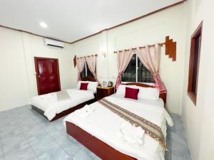 Postel nebo postele na pokoji v ubytování Lotus Blanc Homestay