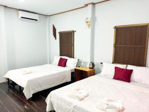 Postel nebo postele na pokoji v ubytování Lotus Blanc Homestay