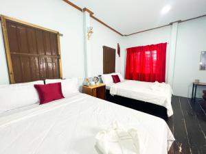 Postel nebo postele na pokoji v ubytování Lotus Blanc Homestay