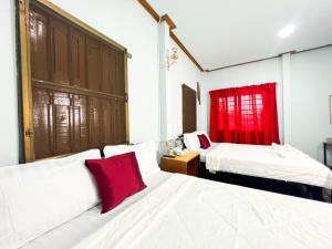 Postel nebo postele na pokoji v ubytování Lotus Blanc Homestay