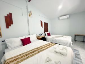 Postel nebo postele na pokoji v ubytování Lotus Blanc Homestay