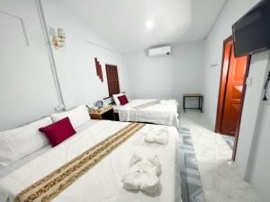 Postel nebo postele na pokoji v ubytování Lotus Blanc Homestay