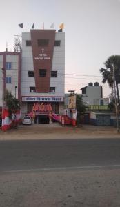 a building with a car parked in front of it at Hotel Vinayak Vihar, Sasaram in Ara