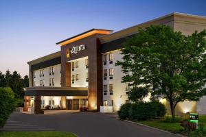 a hotel with a sign on the front of it at La Quinta Inn by Wyndham Columbus Dublin in Dublin