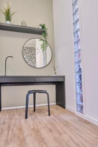a bathroom with a black vanity and a mirror at [MONZA-CENTRO] Modern Flat Near Train Station in Monza