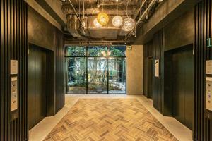 an empty hallway with a large window in a building at Prince Smart Inn Kyoto Sanjo in Kyoto