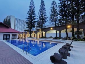 a swimming pool in the middle of a building at Tagaytay Country Hotel in Tagaytay