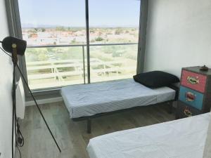 Posteľ alebo postele v izbe v ubytovaní Appartement face à la mer - 6 à 8 personnes - Canet en Roussillon