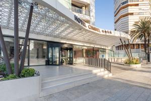 a lobby of a building with a glass facade at Hotel Cimbel in Benidorm