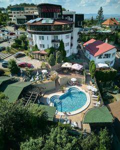 an aerial view of a hotel with a swimming pool at Hotel Belvedere in Braşov