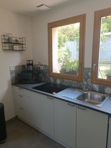 Η κουζίνα ή μικρή κουζίνα στο Gite Pak'Home maison à la campagne de plain pied