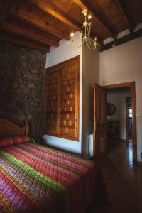 A bed or beds in a room at La Casa de Consuelo 3