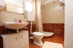 a bathroom with a toilet and a sink at Apartments with a parking space Zuljana, Peljesac - 254 in Žuljana